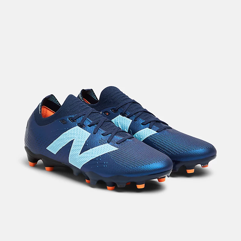 TEKELA PRO LOW FG V4+ Unisex cipő - NB sötétkék, csapatkék és élénk mangó színben