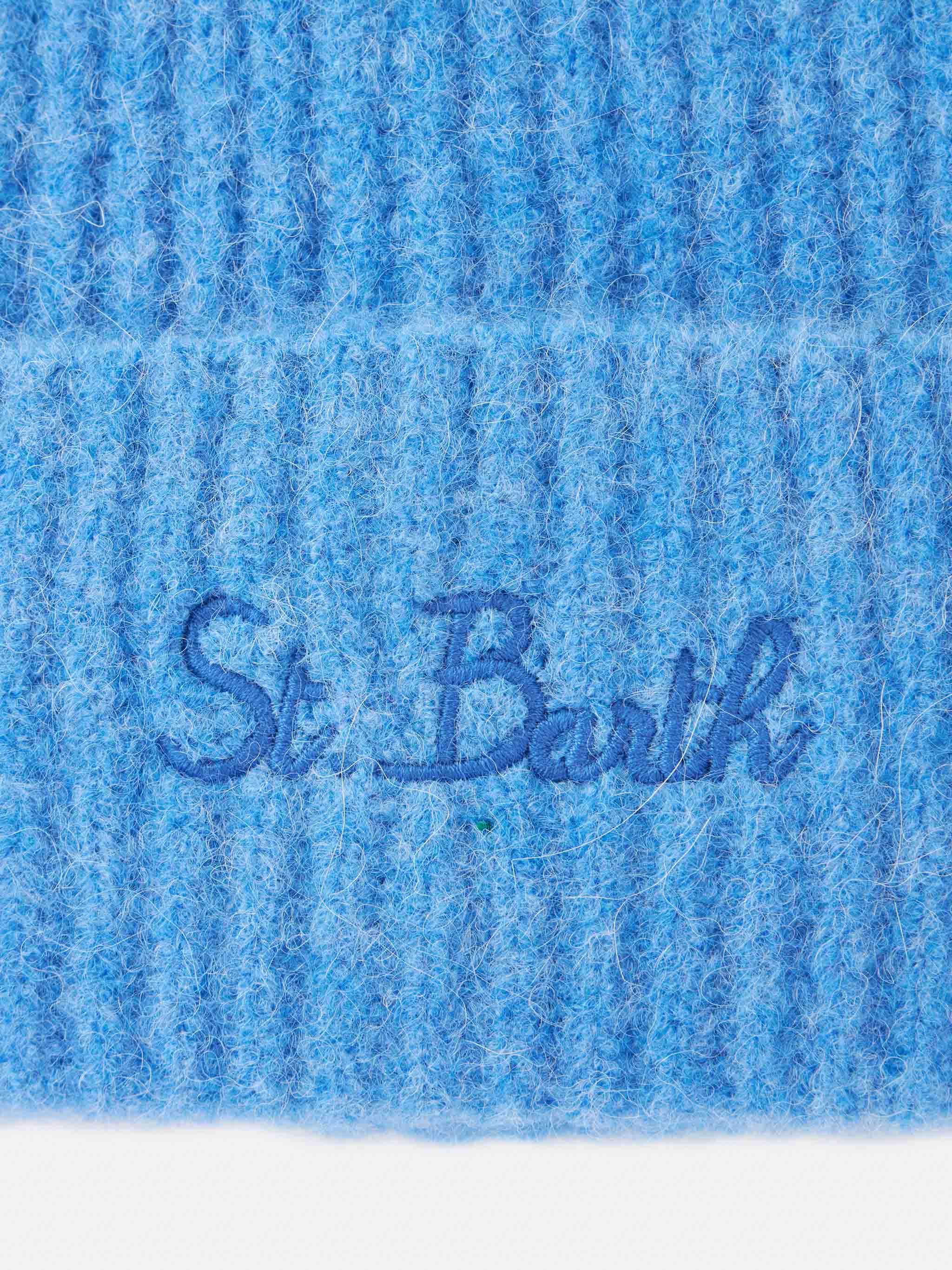 Damesmuts van stretchwol in mosgroen poederblauw