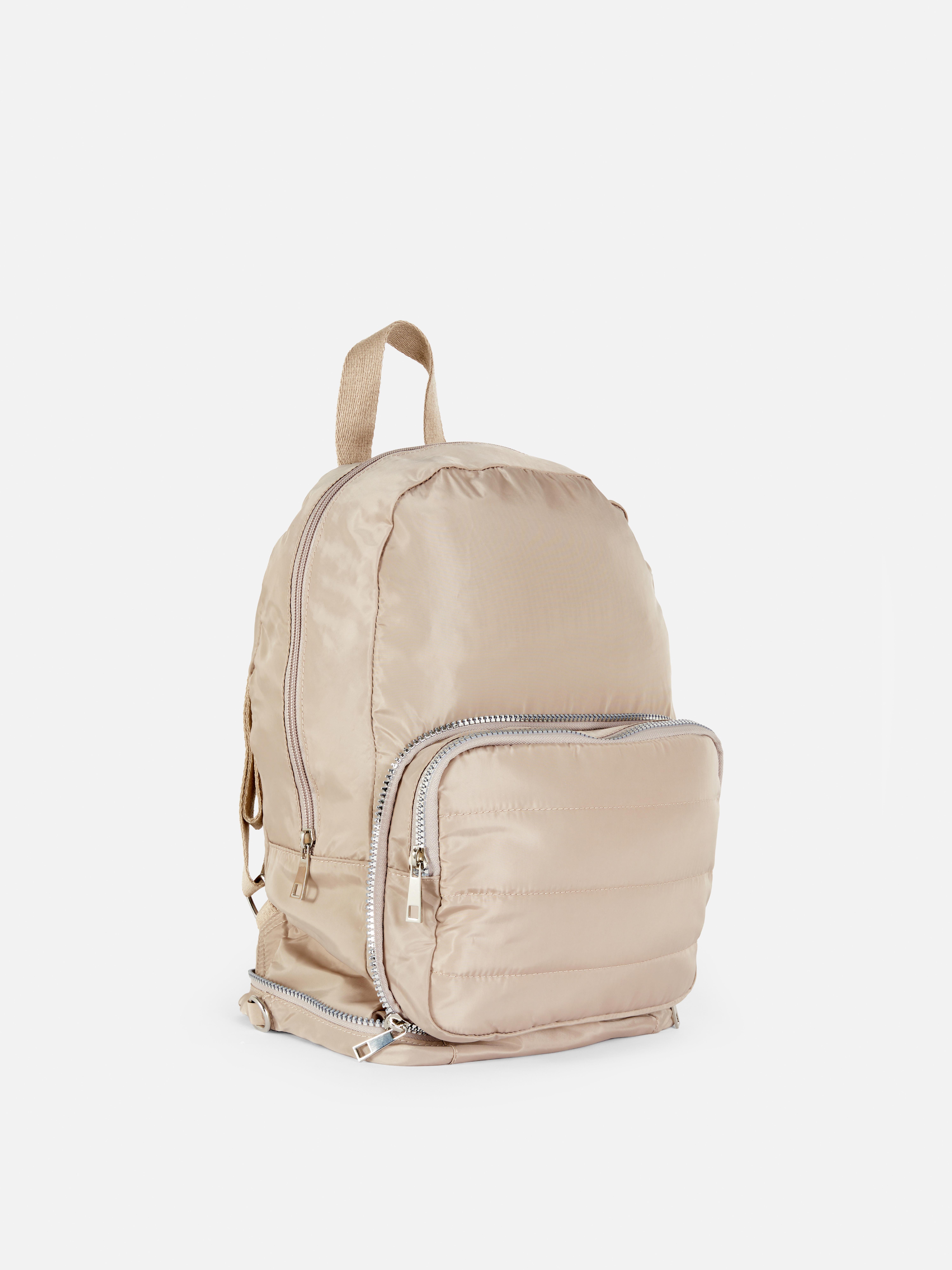Geantă căptușită două într-unul. Un rucsac și o geantă crossbody într-o singură geantă elegantă.