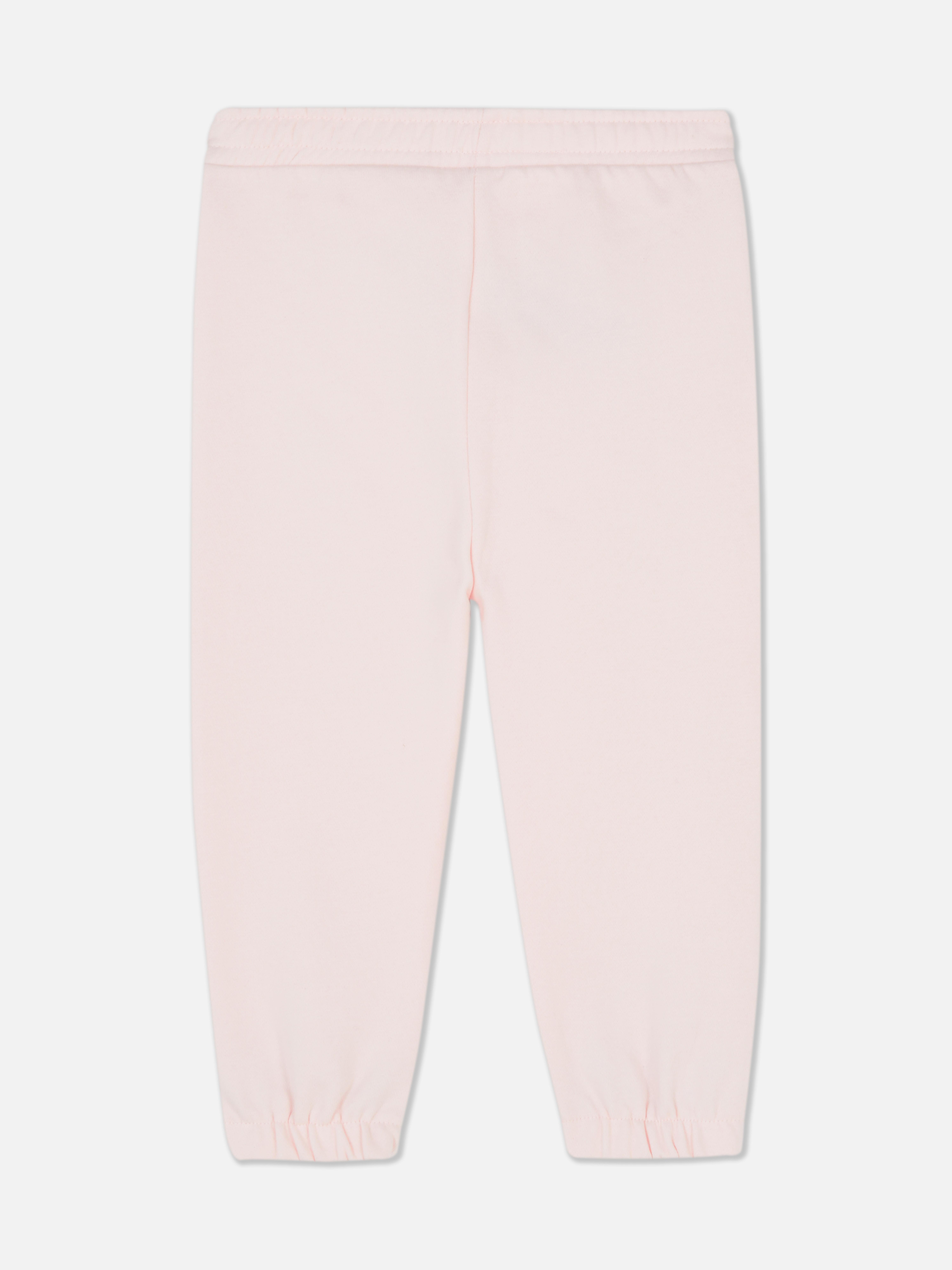 Pantaloni de trening asortați cu imprimeu Disney. Pantaloni de trening elastici cu manșete la gleznă și imprimeu Winnie the Pooh.