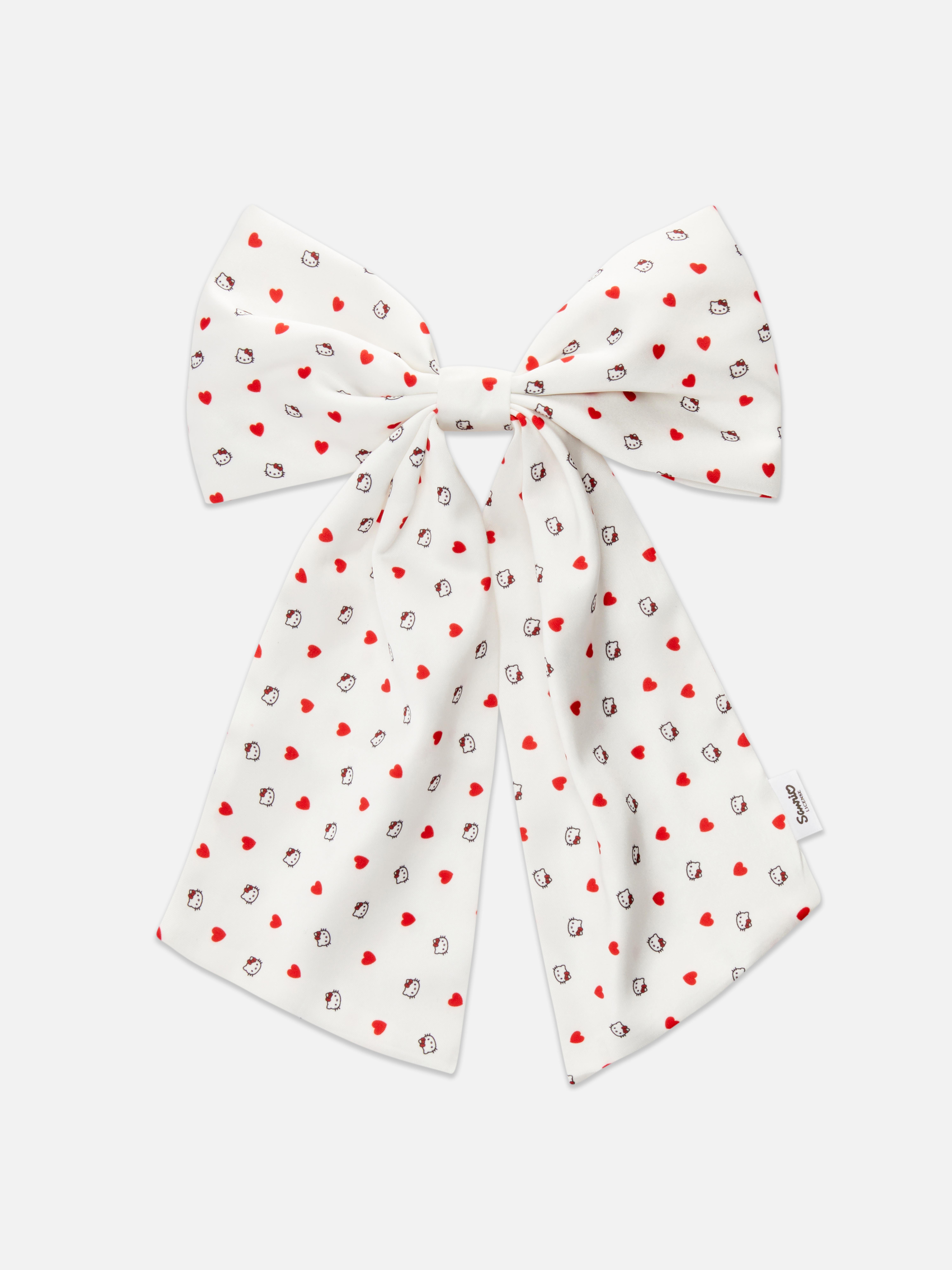 Hello Kitty hajmasni Ez a hajmasni Hello Kitty motívumokkal díszített mintával díszített.