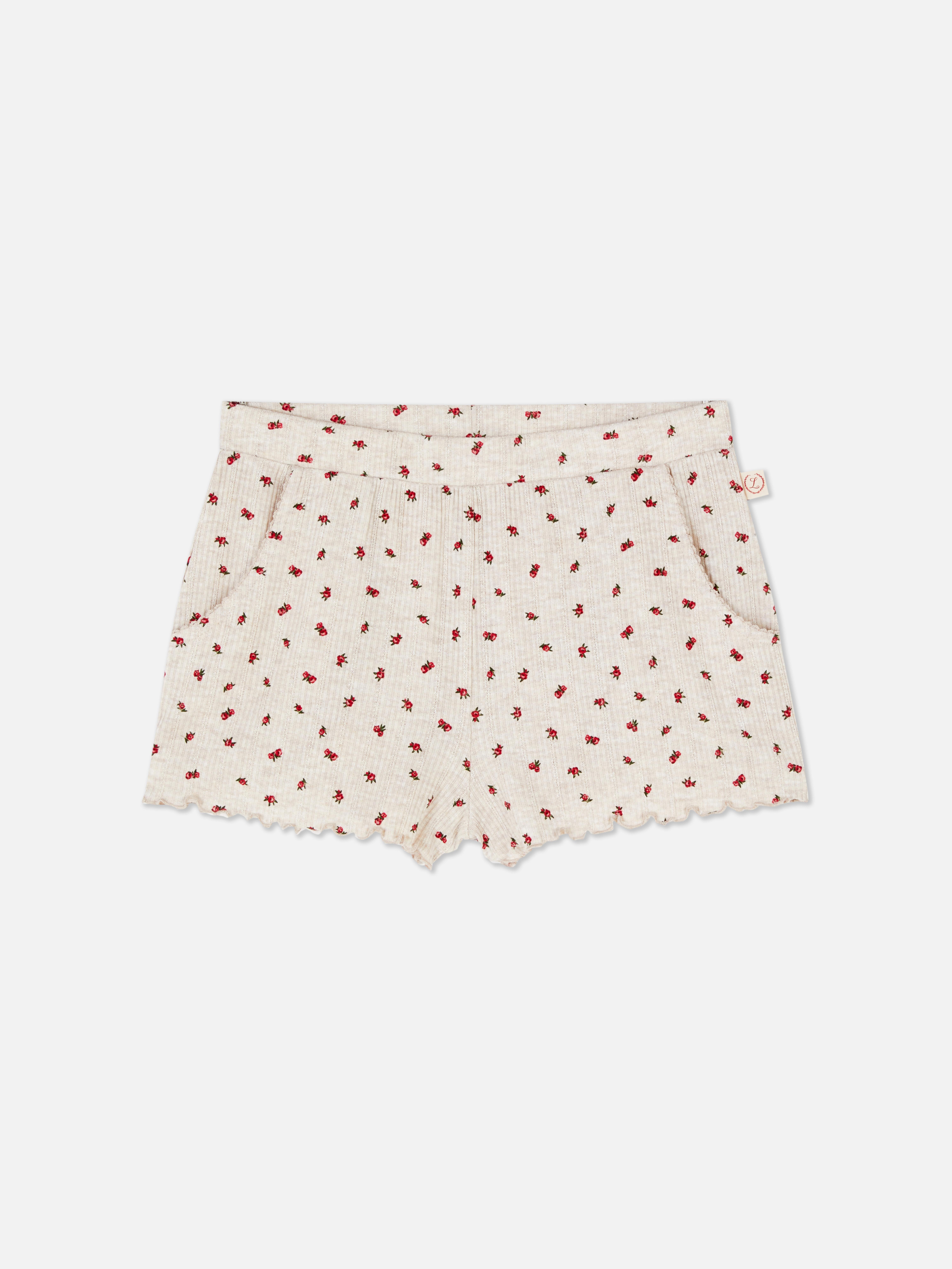 Pantaloni scurți de pijama cu modele florale Pantaloni scurți de pijama cu modele florale contrastante, buzunare laterale și tiv festonat