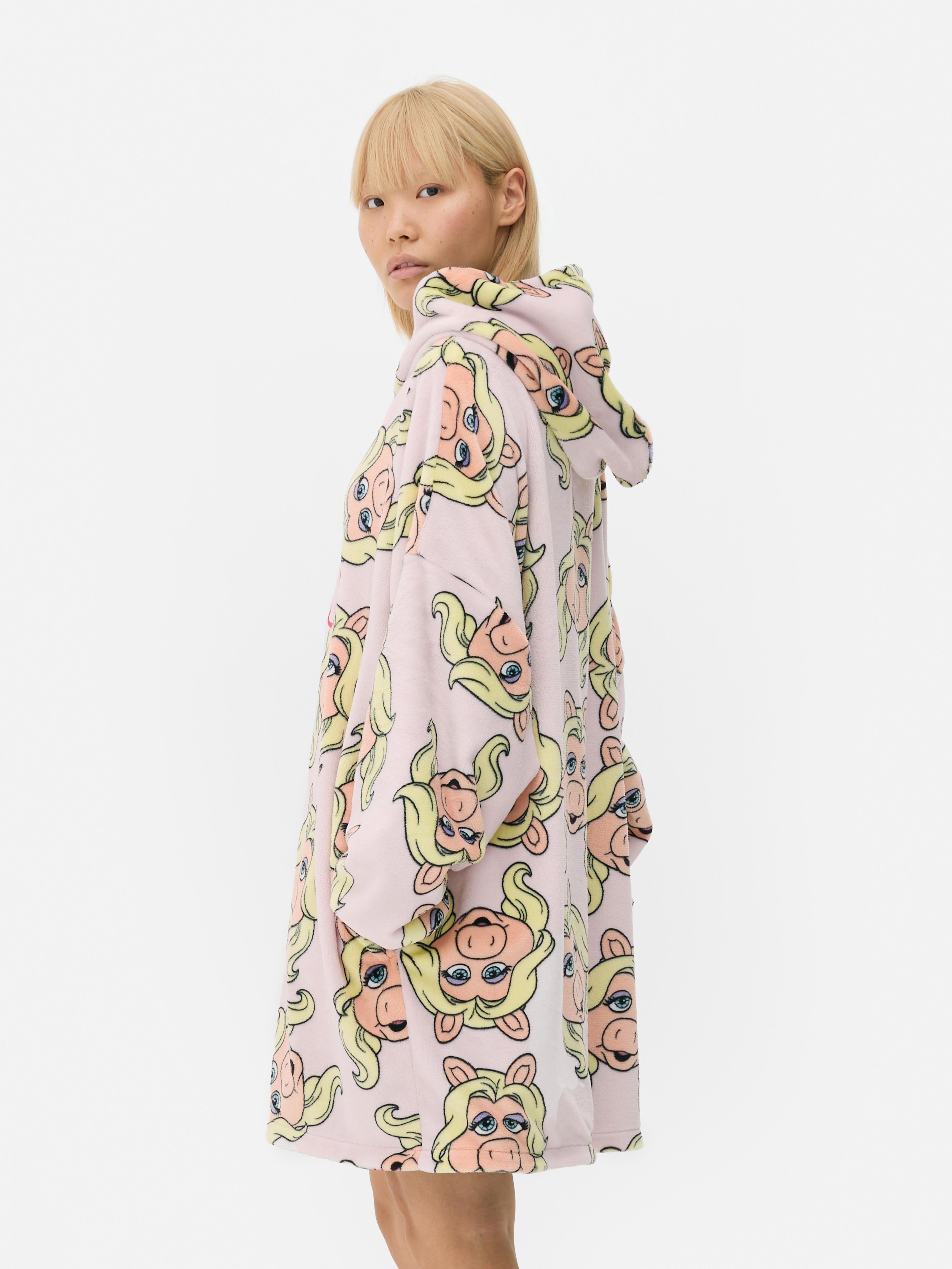 Snuddie reversibil cu Muppets. Un snuddie moale cu un model cu Muppets pe ambele părți.