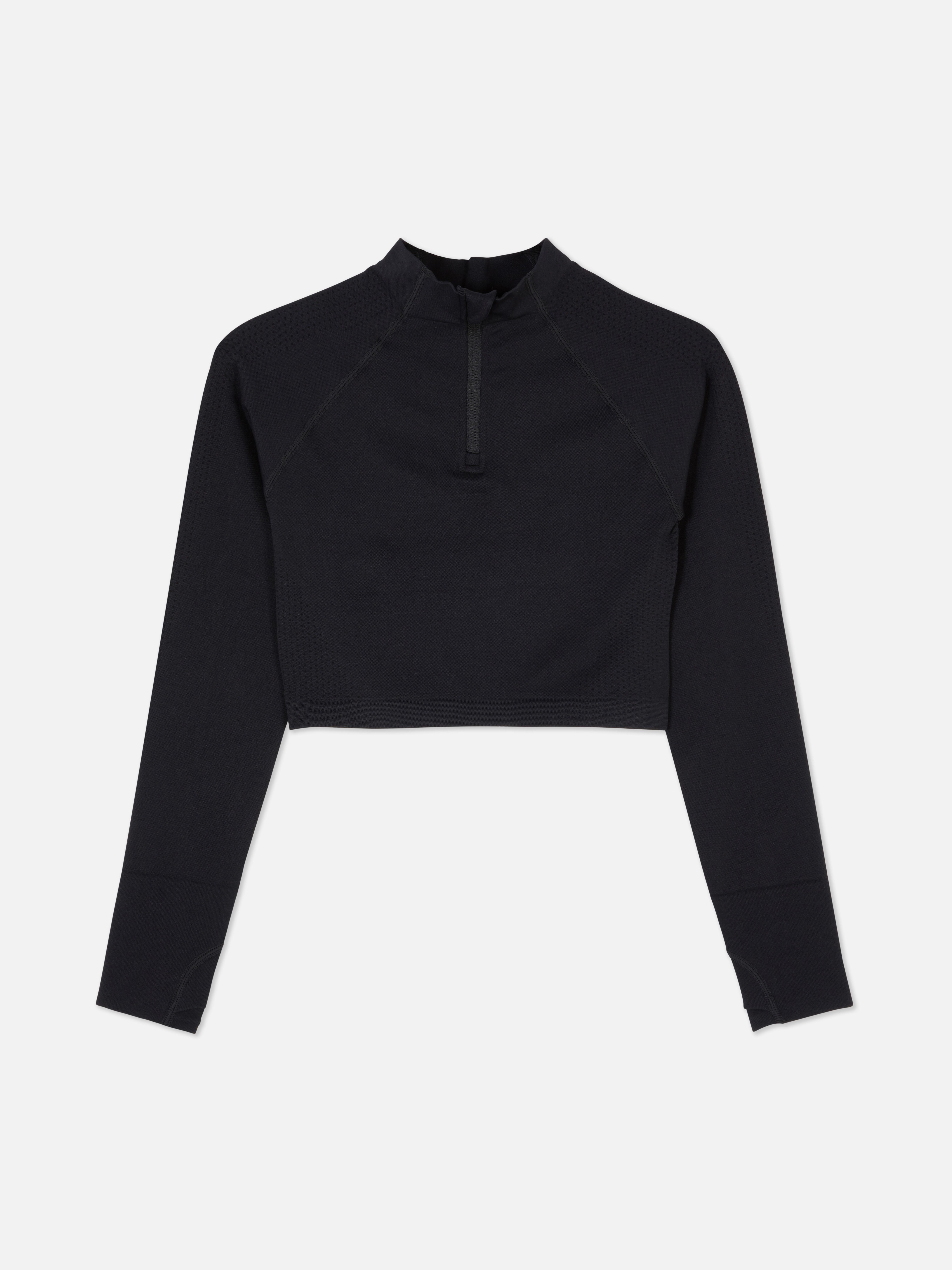 Top sport modelator cu mâneci lungi, fără cusături. Acest top sport scurt, cu fermoar pe jumătate și design fără cusături, este funcțional și elegant.