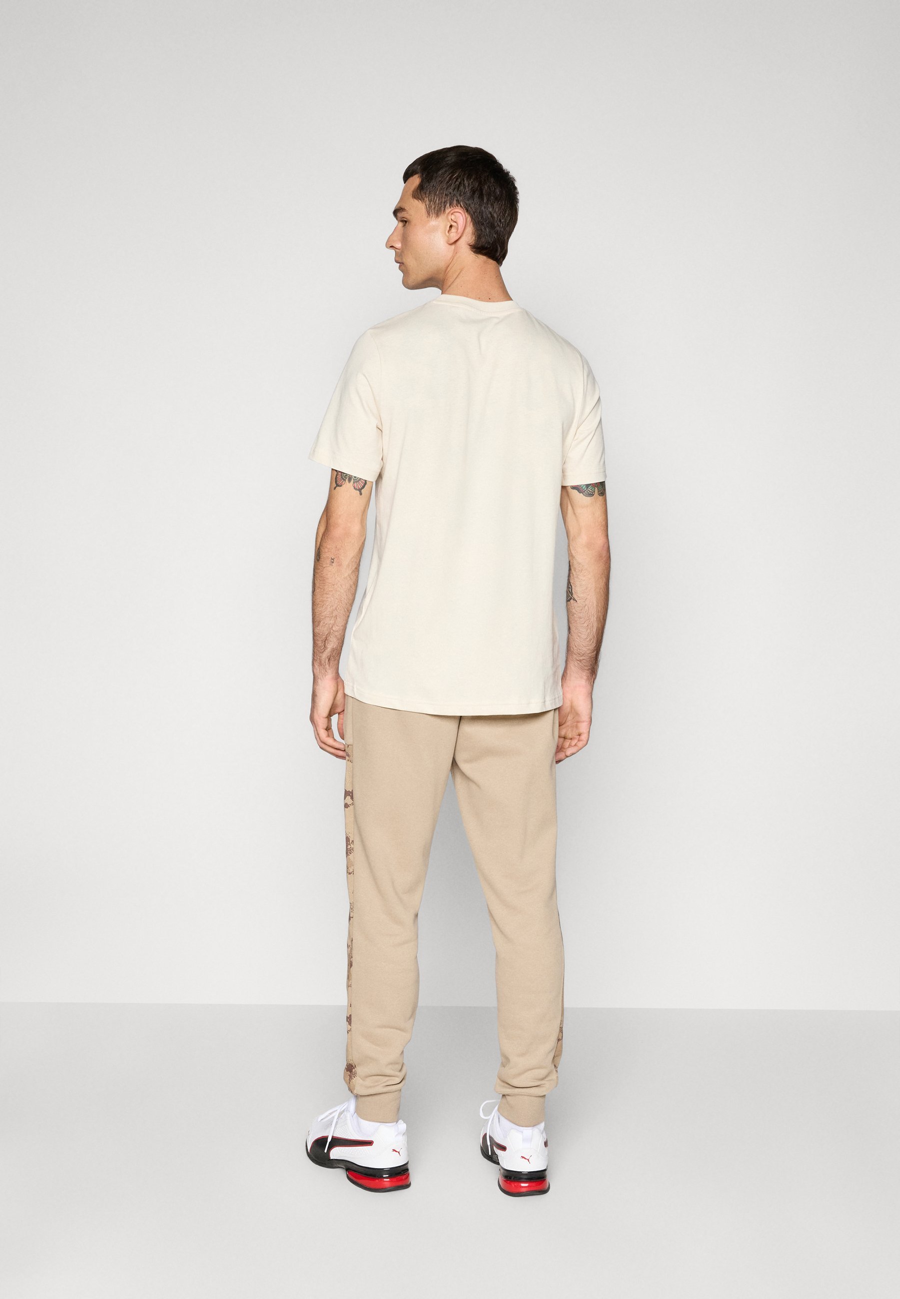 Pantalon de survêtement Puma CAMO - café glacé