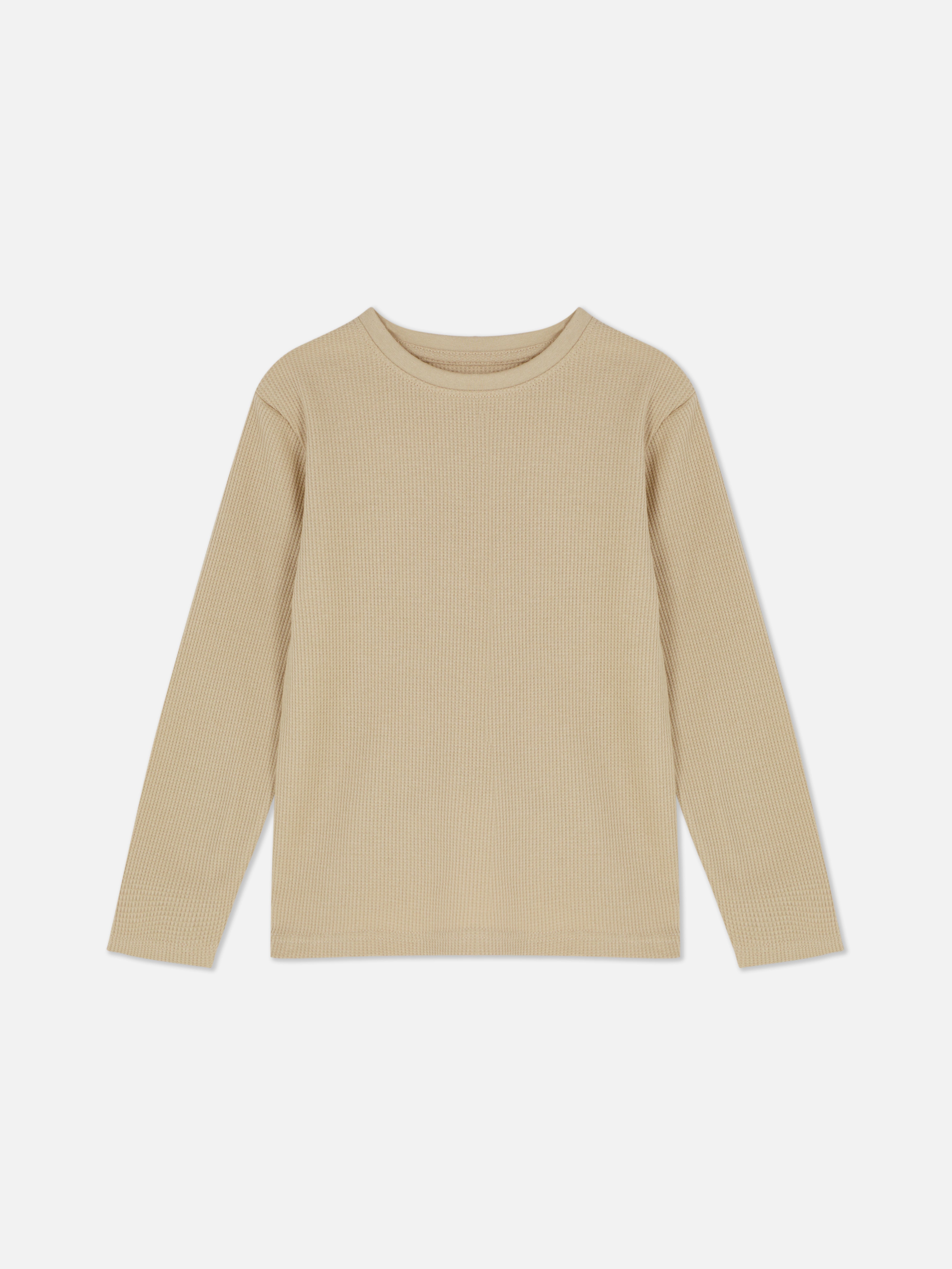 Waffelstruktur-T-Shirt mit langen Ärmeln. Dieses strukturierte T-Shirt hat einen Rundhalsausschnitt und lange Ärmel.