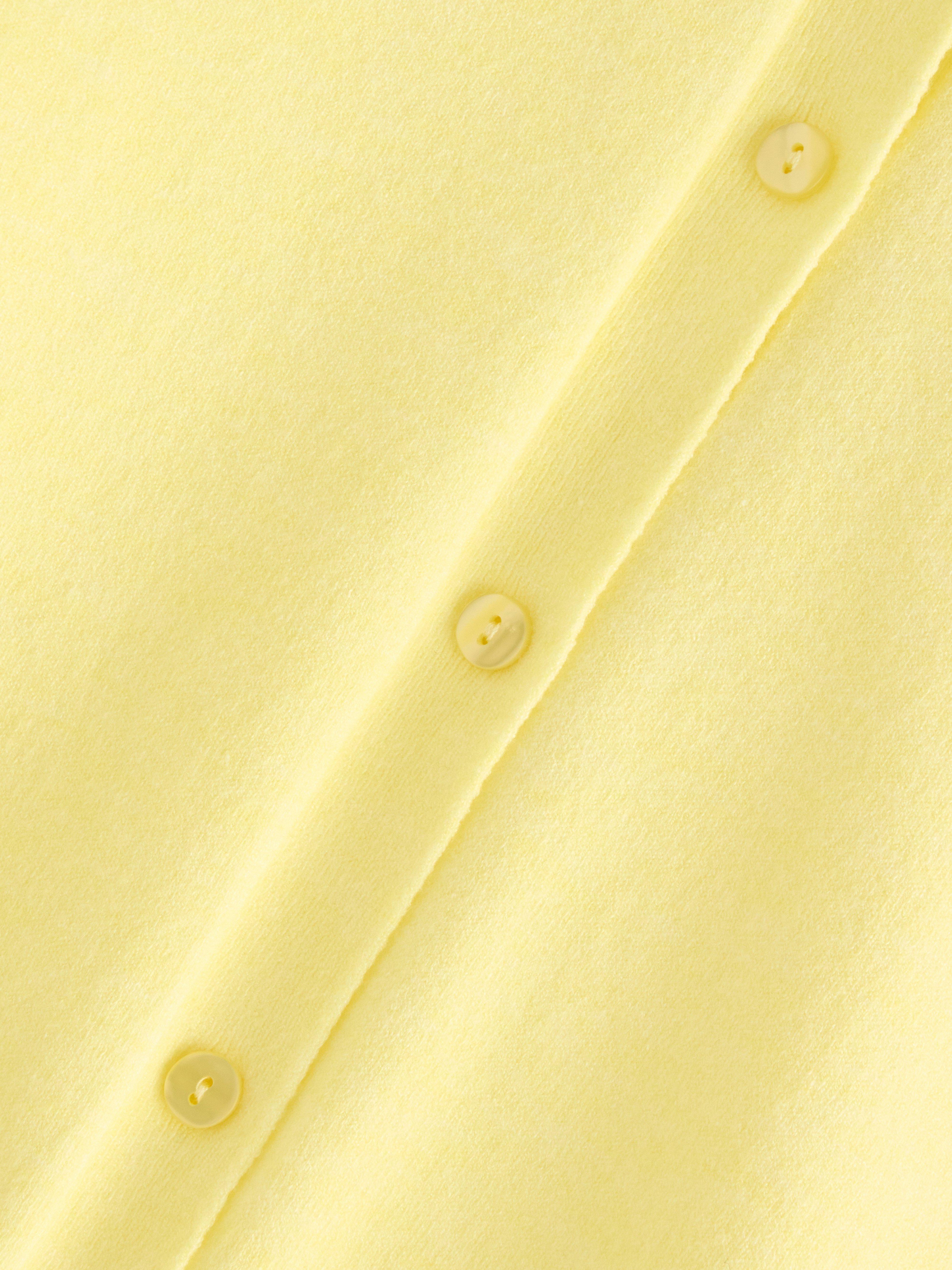 Cárdigan de punto fino amarillo