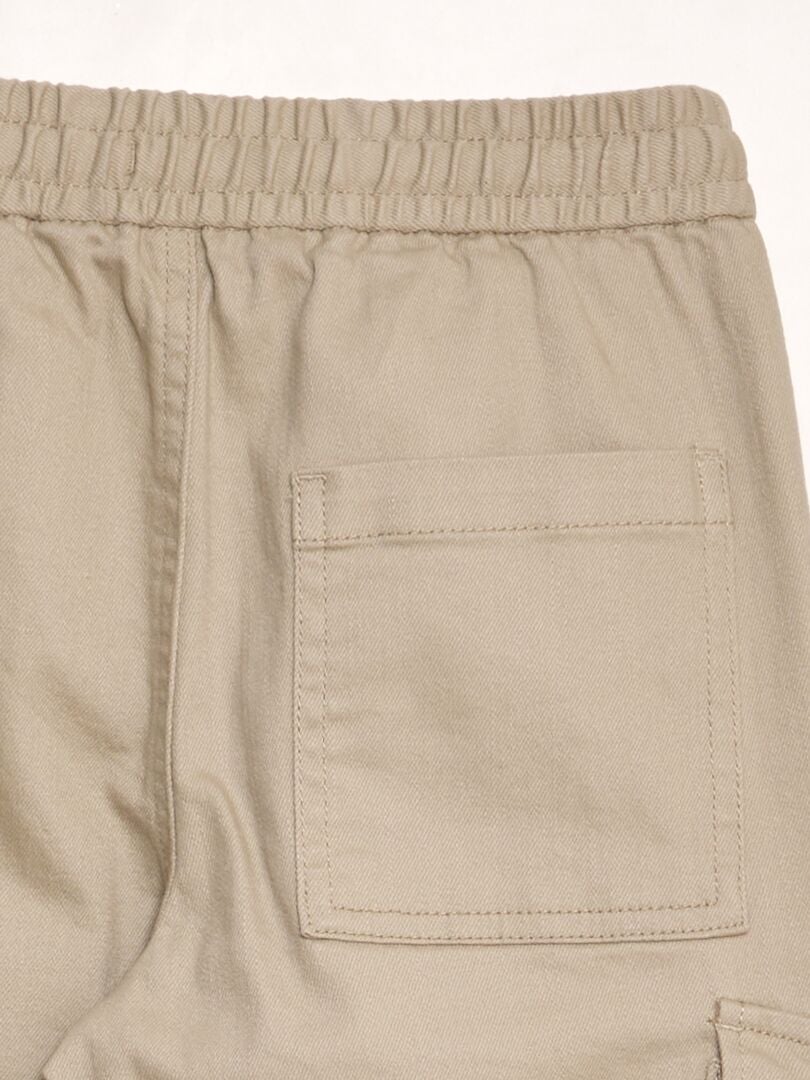 Fleecejoggingbyxor med sidofickor - BEIGE