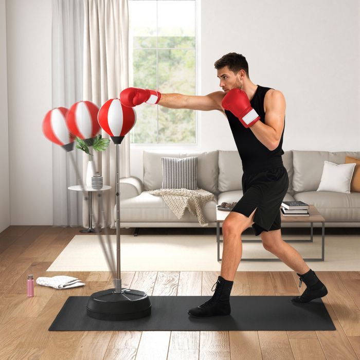 Saco de boxeo independiente HOMCOM, altura ajustable de 126 a 144 cm, con guantes, bomba y base lastrada, color rojo.