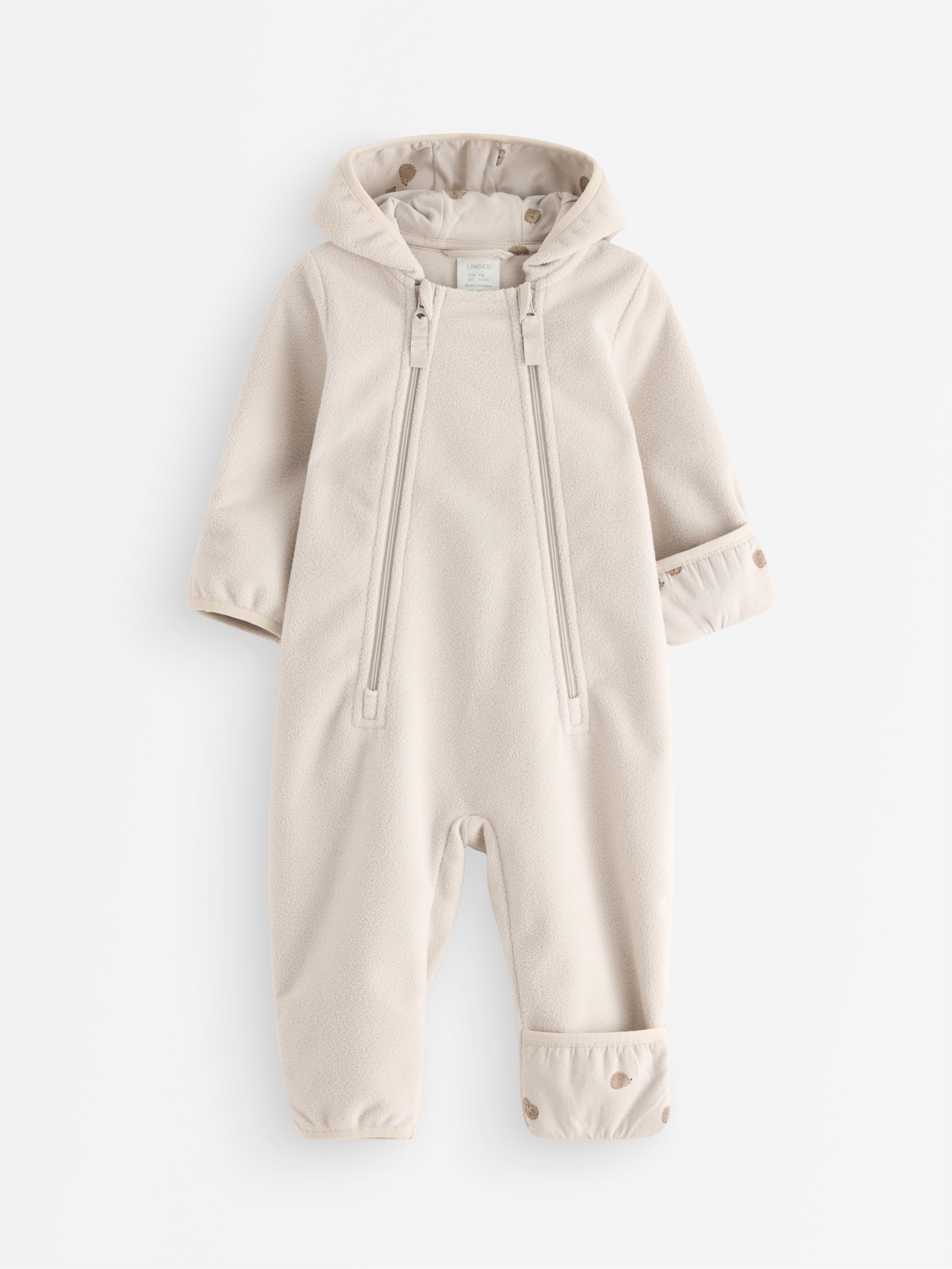 Mono de forro polar Vind, color beige claro.