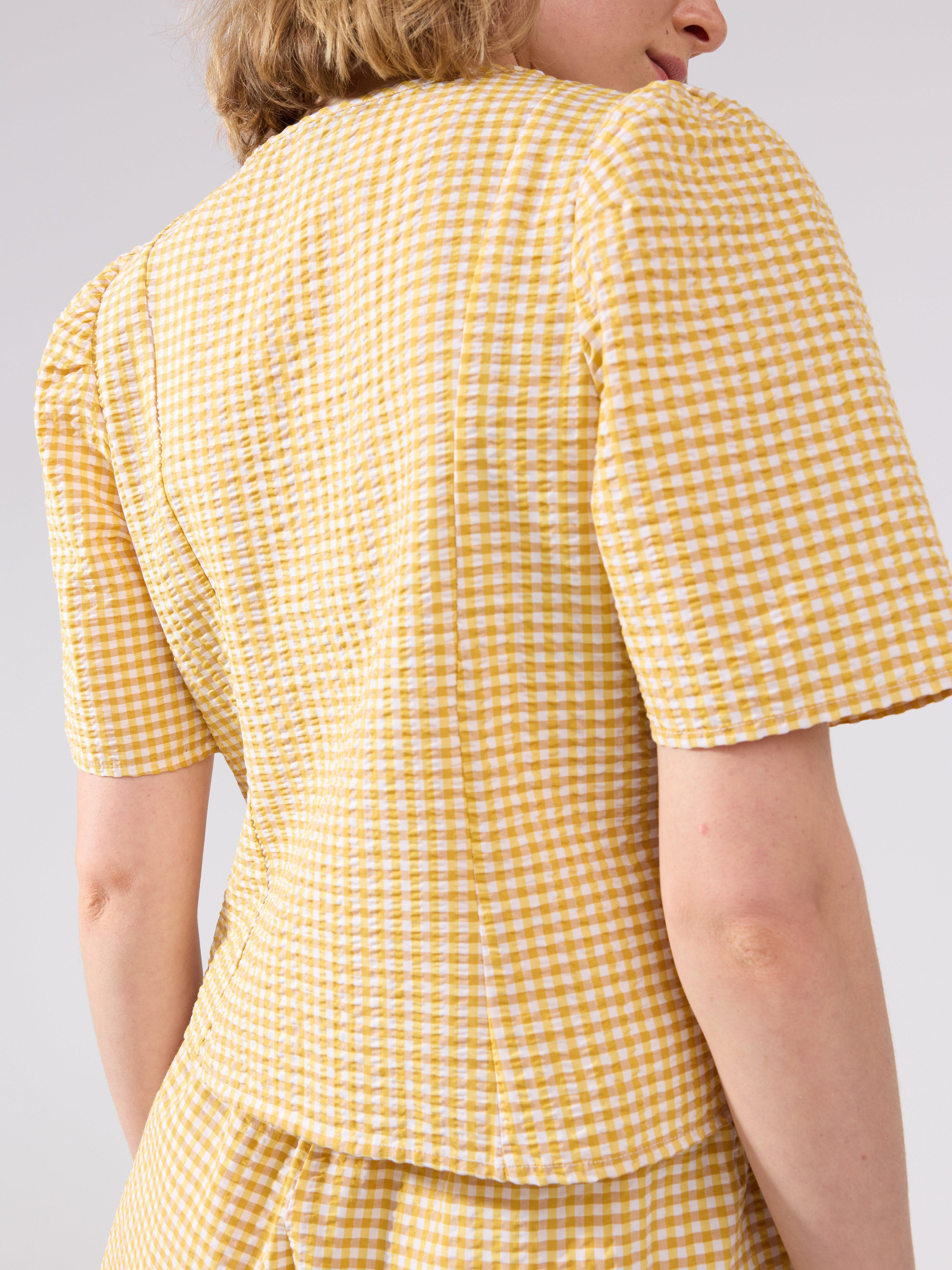 Blusa con estampado de pelícanos amarillos