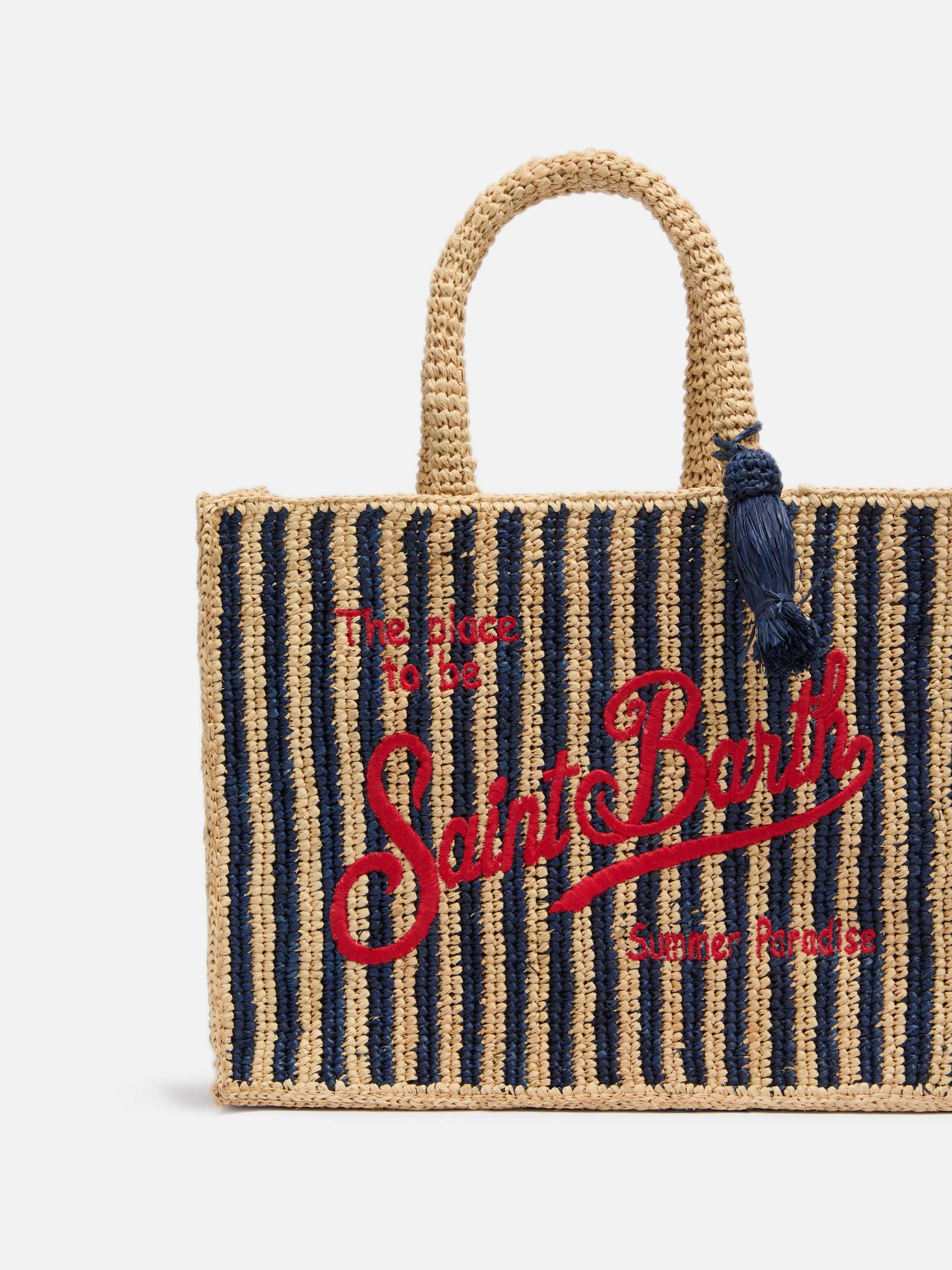 Colette-tas van marineblauwe gestreepte raffia met geborduurd logo.