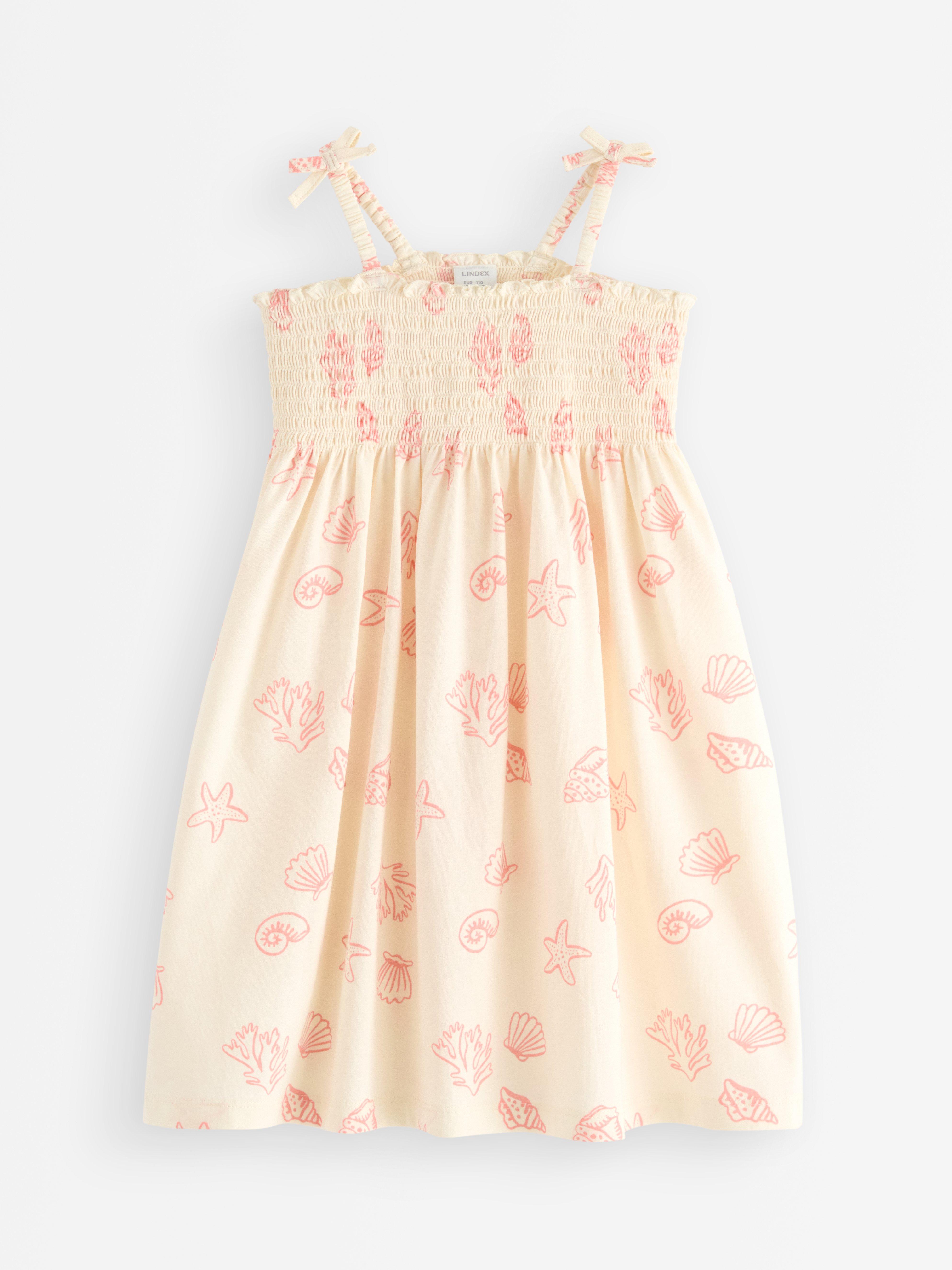 Robe blanche sans manches