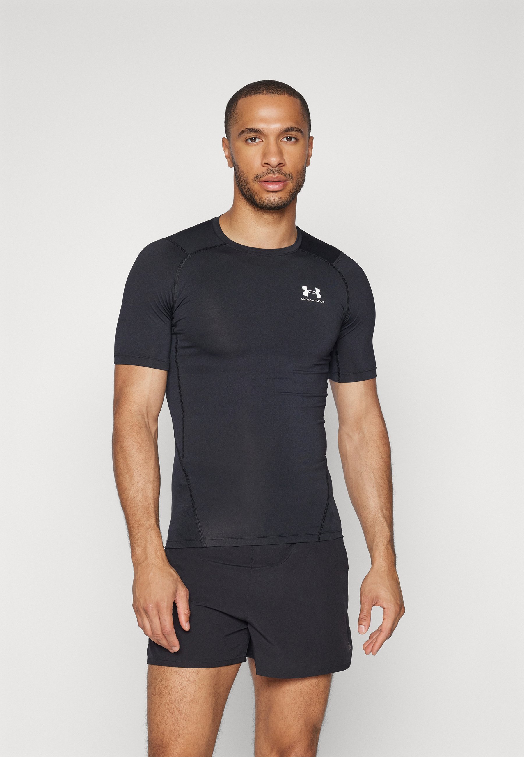 Under Armour HEATGEAR - Koszulka sportowa - czarno-biała