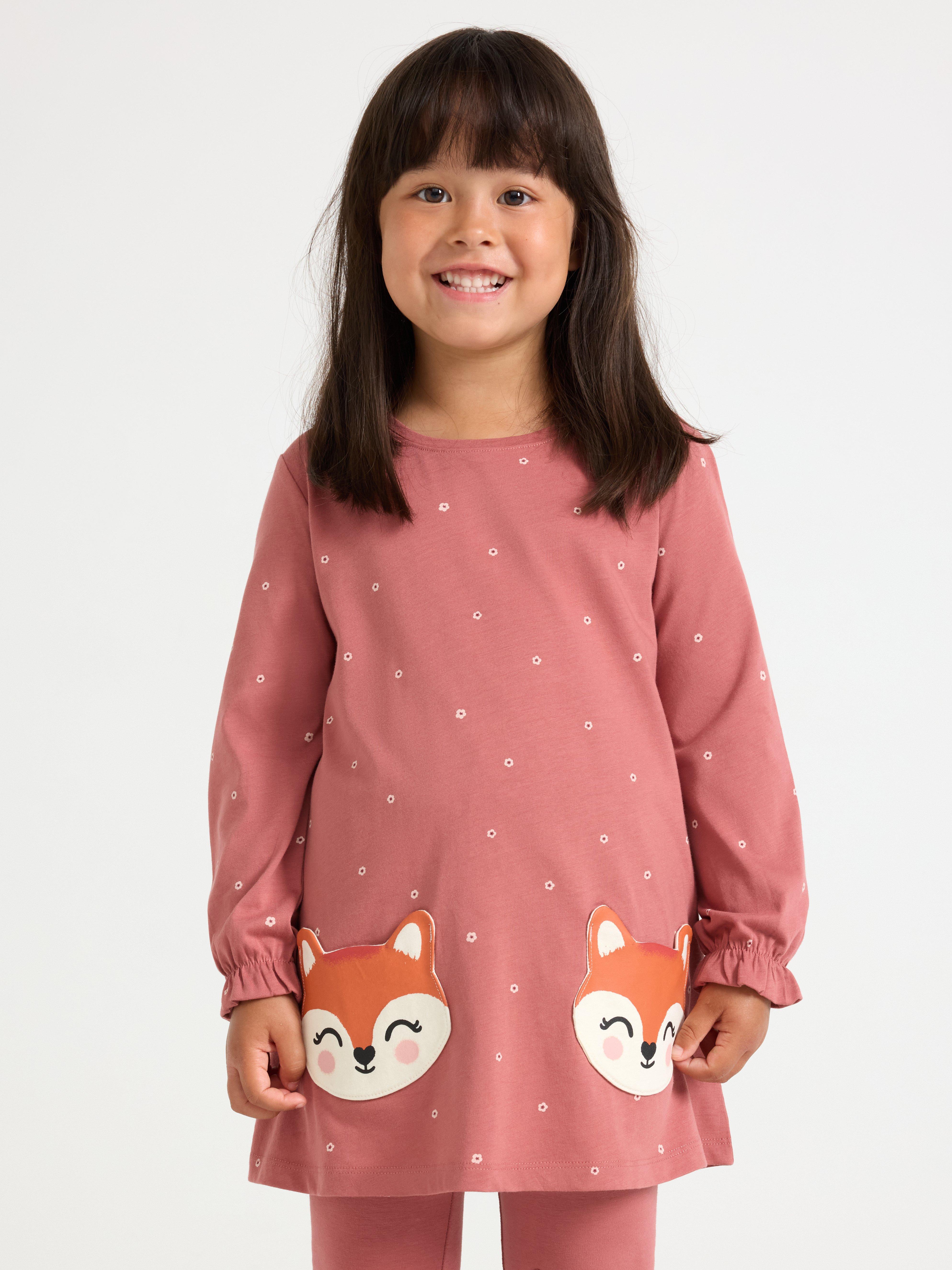 Túnica de manga comprida com bolsos divertidos. Rosa escuro acinzentado.
