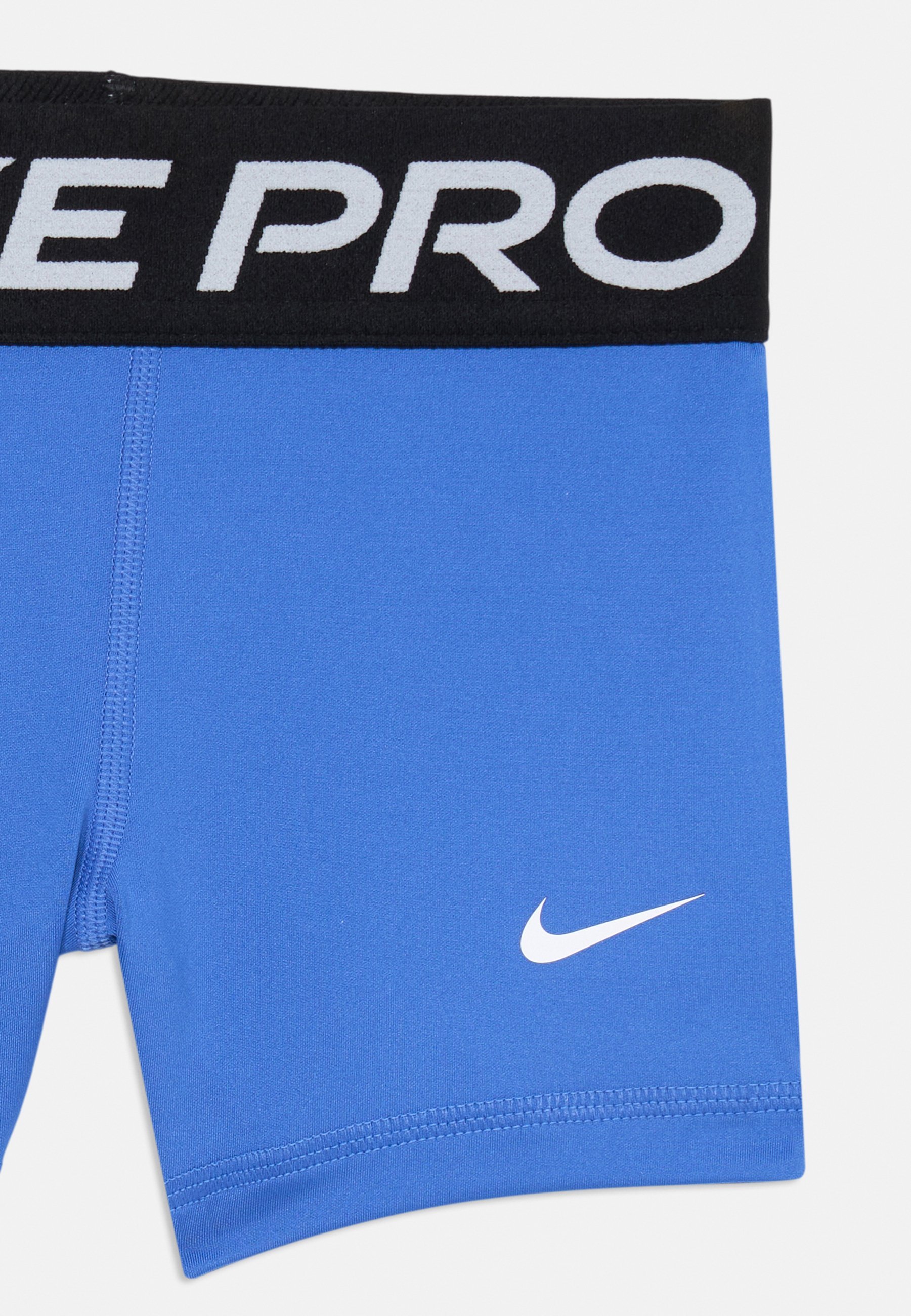 Nike Performance UNISEX - Spordipüksid - komeedisinine/valge