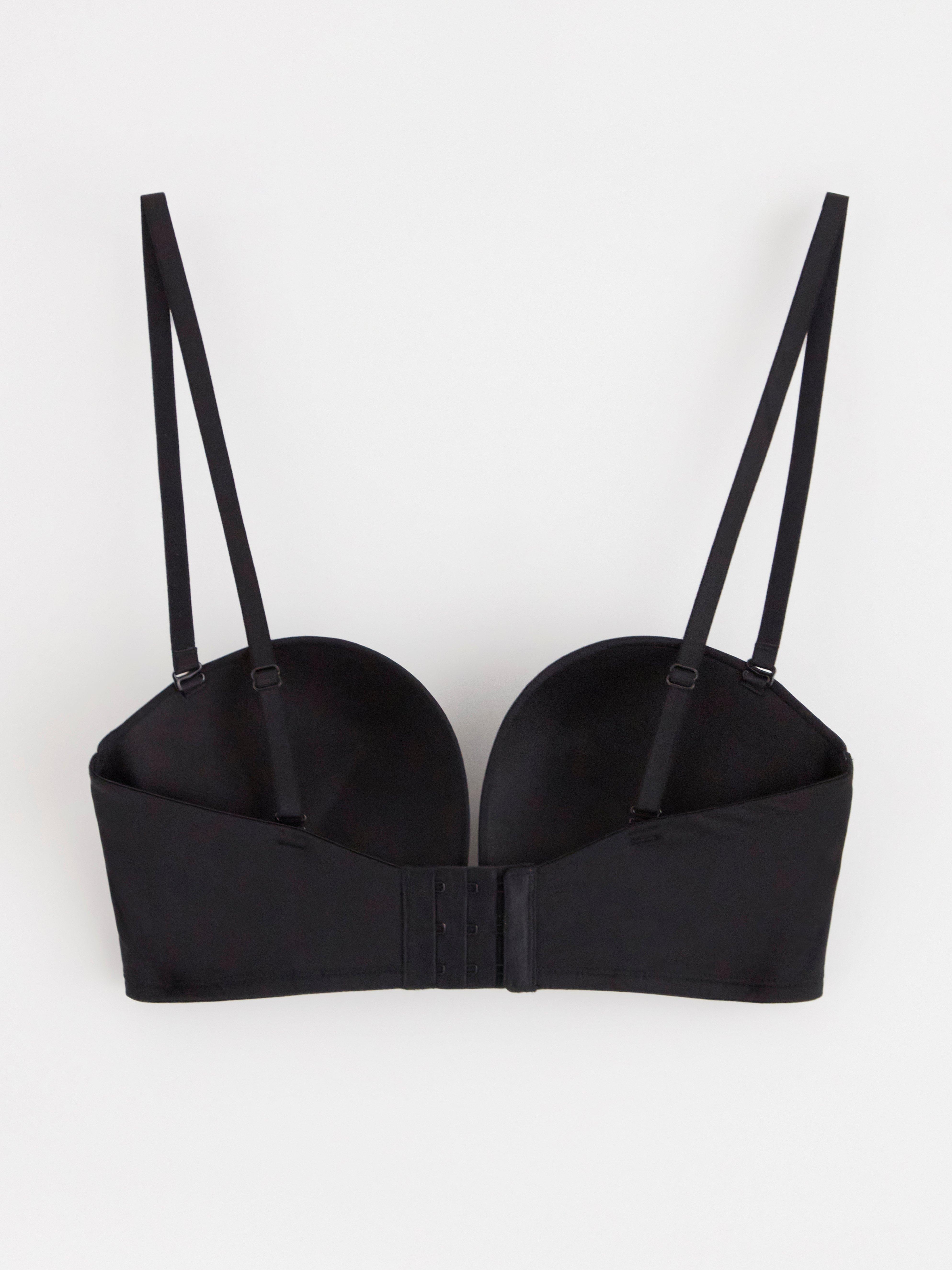 Sujetador push-up sin tirantes con escote pronunciado, color negro.