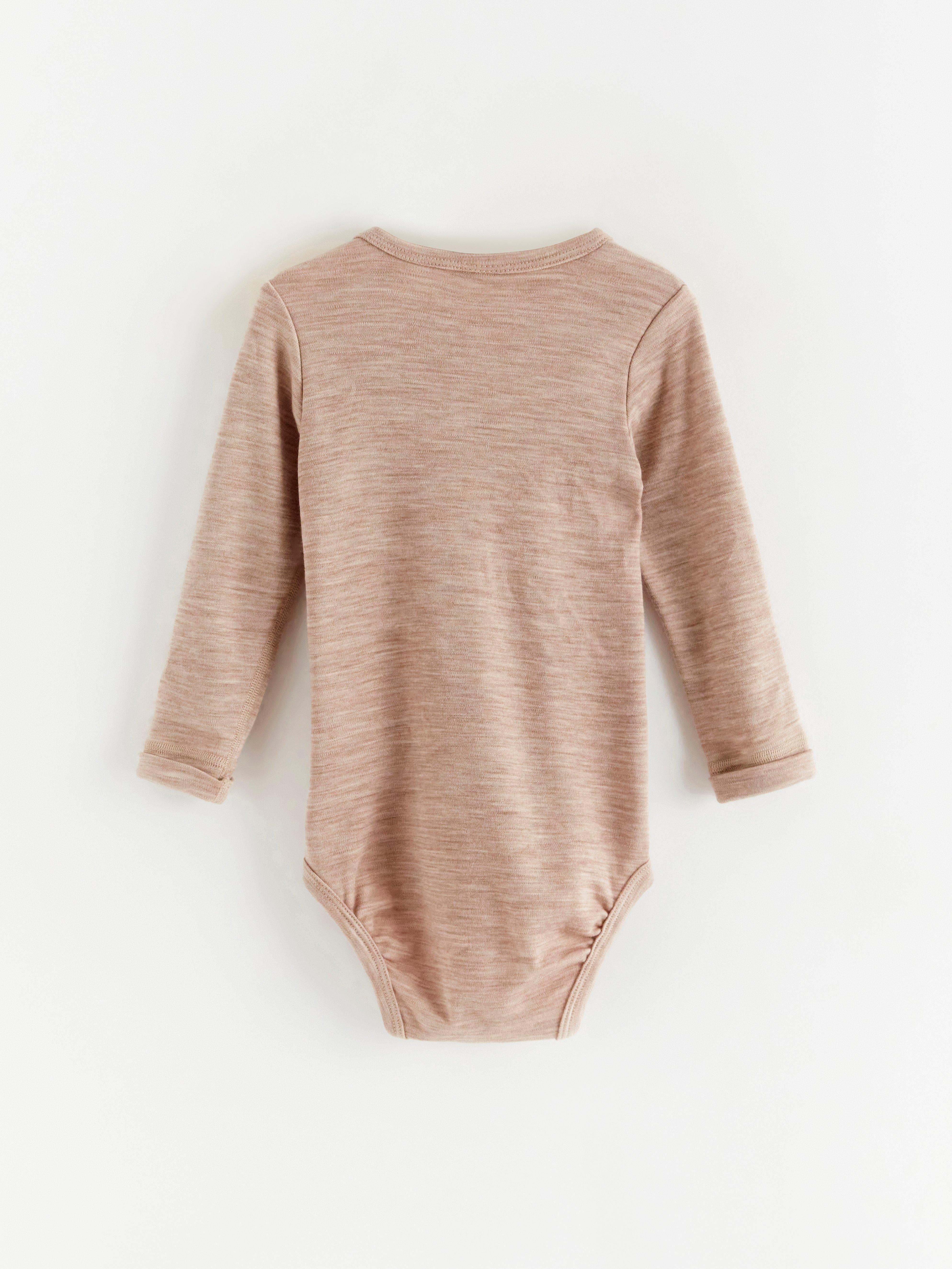 Långärmad body i merinoull Light Beige Melange